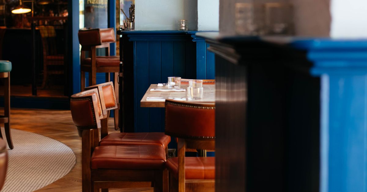 Elegant restaurant dining room with diners enjoying meals